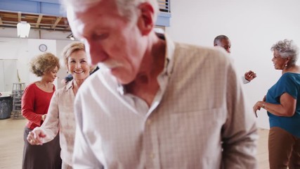 People Having Fun Attending Dance Class In Community Center - Powered by Adobe
