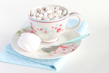 A Cup of cocoa and marshmallows on a white background.