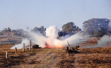 Fototapeta premium Explosions of bombs and shells. Reconstruction of the battle of world war II. Battle for Sevastopol. Reconstruction of the battle with explosions.Explosions of bombs and shells. Reconstruction of the 