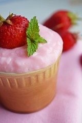 Delicious strawberry pudding in a ceramic Cup and fresh strawberries.Healthy diet.