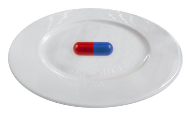 pills on plate isolated on white