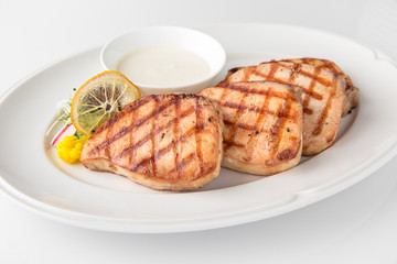 Grilled salmon fish fillet (red fish). Seafood. Banquet festive dishes. Fine dining restaurant menu. White background.