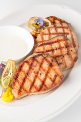 Grilled salmon fish fillet (red fish). Seafood. Banquet festive dishes. Fine dining restaurant menu. White background.