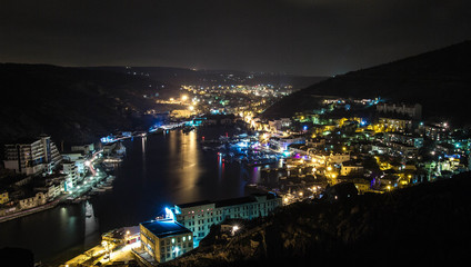 Night landscape Balaklava, Crimea. Landscape of night city and sea Bay