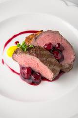 Filet mignon Beef, or Pork. Grilled young calf tenderloin with berries, mashed potatoes. Banquet festive dishes. Fine dining restaurant menu. White background. 