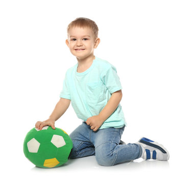 Cute Little Child With Soft Soccer Ball On White Background. Playing Indoors