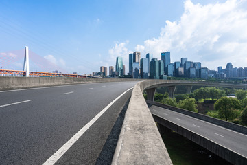 road with city skyline