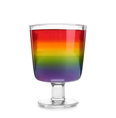 Tasty layered jelly dessert in glass on white background