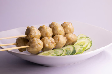 Street food meat ball sticks on grill. At Thailand