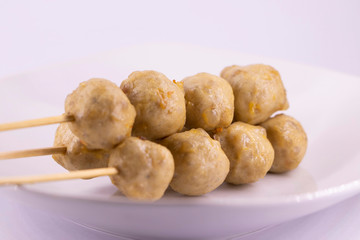 Street food meat ball sticks on grill. At Thailand