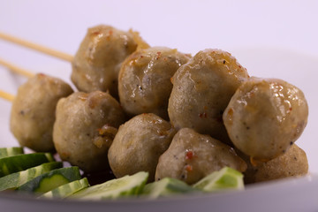 Street food meat ball sticks on grill. At Thailand