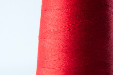 red overlock sewing thread on large yarn spool