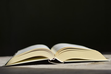 open book on black background