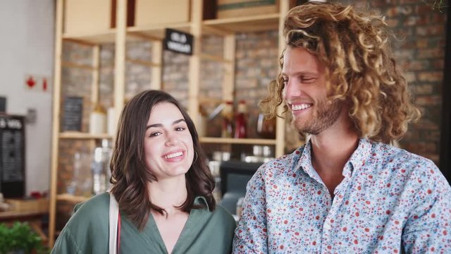 Portrait Of Young Couple Shopping In Sustainable Plastic Free Grocery Store