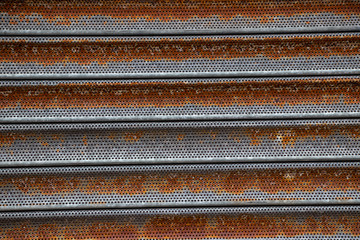 Rusty corrugated metal shutter texture background