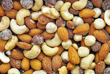 Mix nuts top view including hazelnuts, cashews, almonds. Nut background, copy space for text concept.
