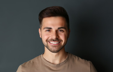 Fototapeta premium Portrait of handsome man on dark background