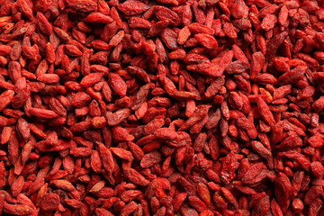 Fototapeta premium Many dried goji berries as background, top view. Healthy superfood