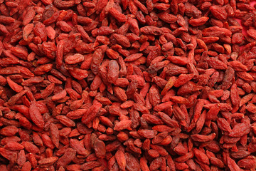 Many dried goji berries as background, top view. Healthy superfood