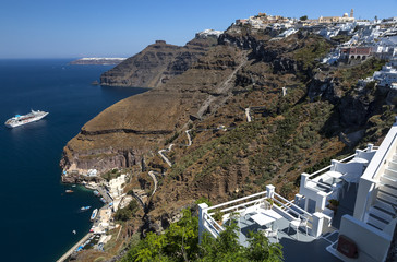 Fira panoramic view, Santorini island with donkey path and cable car from old port, high volcanic rocks in Greece.