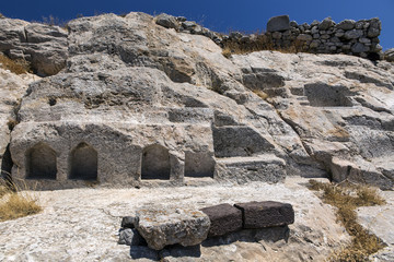 The ruins of ancient Thira, a prehistoric village at the top of the mountain Mesa Vouno, Santorini, Greece.