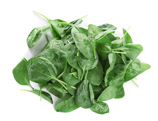 Heap of fresh green healthy baby spinach leaves isolated on white, top view