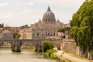 Fototapeta premium View of the Vatican, St. Peter's Basilica, St. angel bridge over the Tiber river. Rome, Italy.