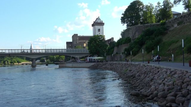 View of the Narva Fortress and bridge, part of the embankment of river Narva.