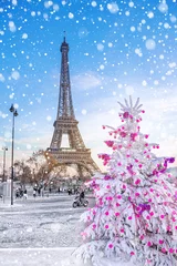 Fotobehang Eiffel Tower is the main attraction of Paris on the background of  Christmas trees covered by snow in winter. Travel Greeting Card from Paris with love, France © MarinadeArt