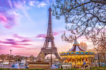 The Eiffel Tower and vintage carousel on a winter evening in Paris, France. - obrazy, fototapety, plakaty