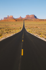 Classic highway view in Monument Valley at sunset, USA