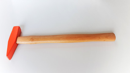 different sides of iron hammer with wooden handle
