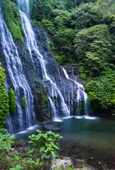 Banyumala waterfall with cascades among the green tropical trees and plants in the North of the island of Bali, Indonesia