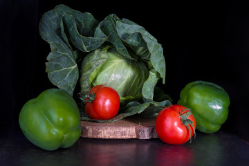 Healthy food while losing weight. Weight loss with diet food. Fresh green Cabbage with red tomatos and green peppers.