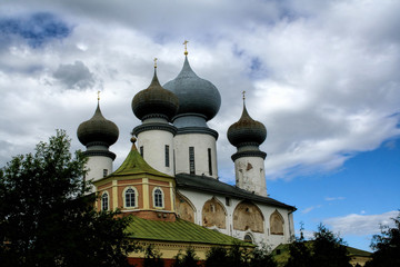 Fototapeta na wymiar Orthodox church on a cloudy day. Church of the Dormition of Tikhvin Monastery built in 1581 