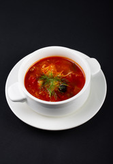 tomato soup in a bowl isolated on white
