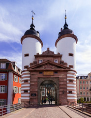 Obraz premium The historical old bridge gate with two towers in Heidelberg , Baden Wuerttemberg, Germany, Europe