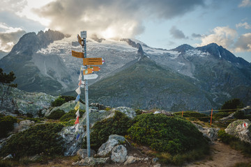 trail markers and prayer flags at the Aletsch Glacier