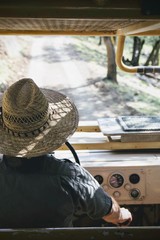 Safari driver behind the wheel of an old 4x4 on a tour.