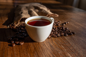 espresso and coffee beans on a table