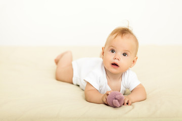 Portrait of happy smile baby relaxing on the bed