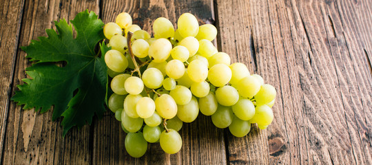 White grapes on wooden background, long banner