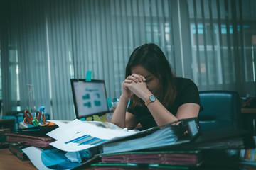 Asian office woman stress from work overload,She stressed because must send work At the specified...
