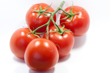  red tomatoes on a white background