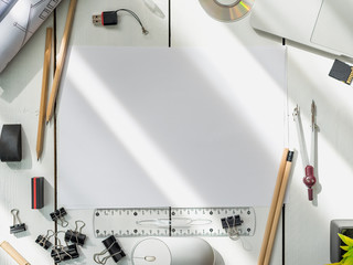 Architectural plans, pencil and ruler on the table. Laptop and workplace accessories. Place for...