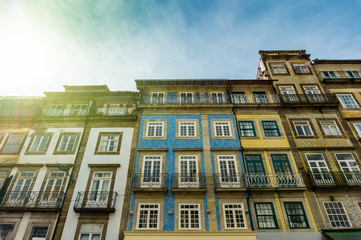 Street view on the old buildings with portuguese tiles on the facades in Porto