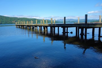 Fototapeta na wymiar A wooden pier on Lake Windermere.