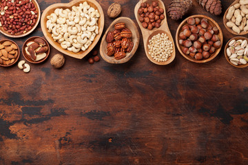 Various nuts selection on wooden table