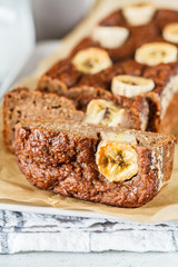 Homemade sliced banana bread on a white background.
