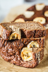 Homemade sliced banana bread on a white background.